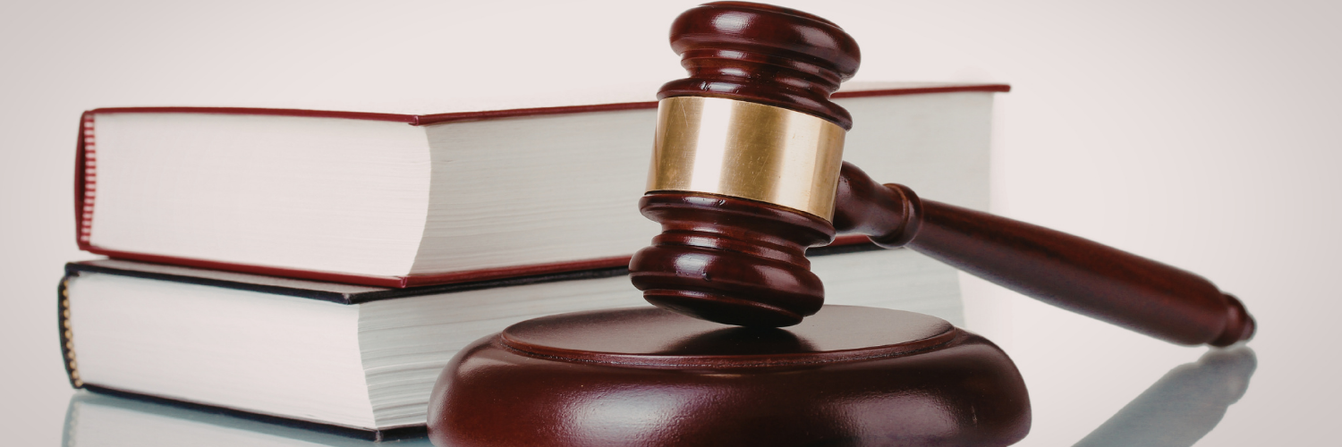 A legal book and Gavel.